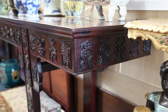 A large Chinese Hundred Shou rosewood (hongmu) altar table, early 20th century, length 258cm, depth 50cm, height 93.5cm, restorations